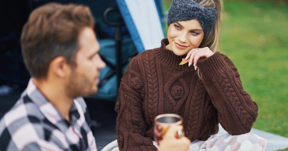 Young nice couple having fun on camping