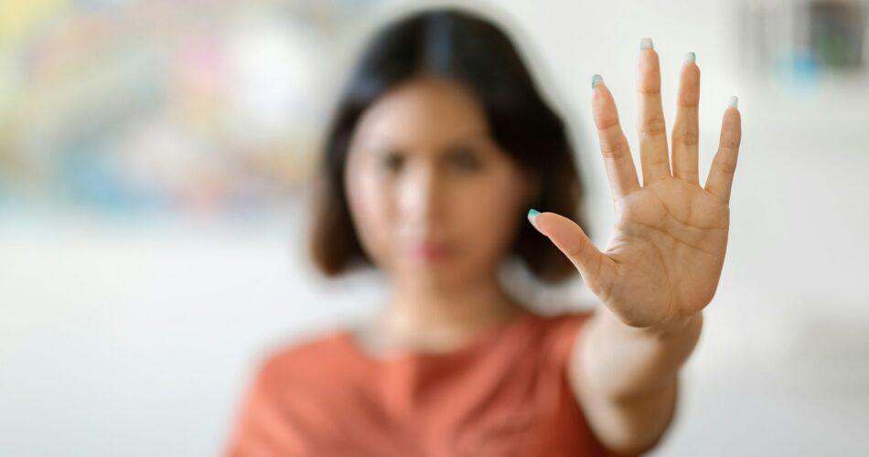 Young Arab Woman Showing Stop Gesture With Open Palm